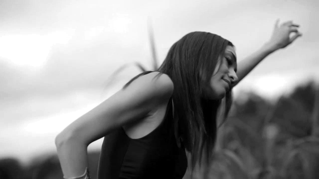 Mona Hassan dancing, black and white